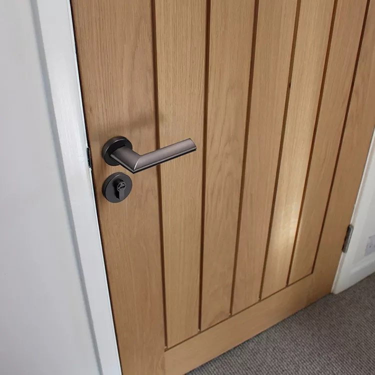 Pavo Lever Door Lock in Brushed Black Nickel & Brushed Brass